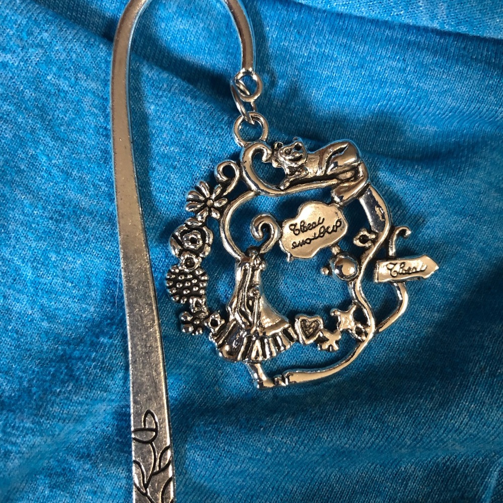 NWT, Handmade by A Charmed Life. Silver 4” Alice in Wonderland Bookmark